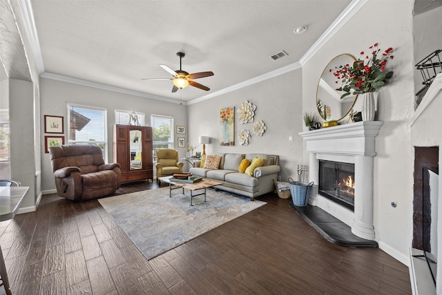 705 Eagle Ct, Mansfield, TX 76063 - living area featuring a glass covered fireplace, a ceiling fan, dark wood-style flooring, crown molding, and baseboards