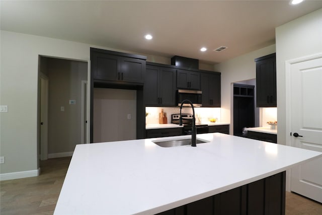 914 S Brazos St, Weatherford, TX 76086 - kitchen with appliances with stainless steel finishes, recessed lighting, light wood-style flooring, light countertops, and baseboards