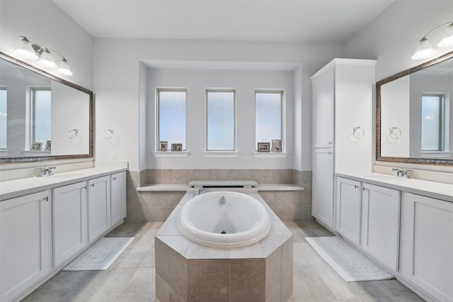 1105 Collared Dove Dr, Little Elm, TX 75068 - full bathroom featuring two vanities and a bath