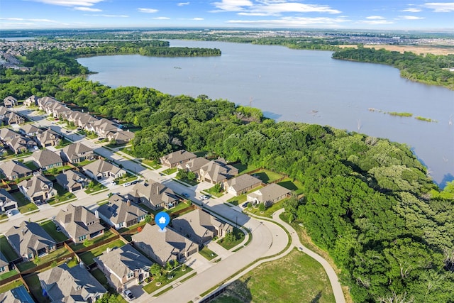 1105 Collared Dove Dr, Little Elm, TX 75068 - aerial view of property and surrounding area featuring nearby suburban area, a nearby body of water, and a heavily wooded area