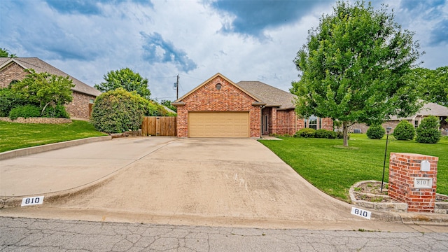 810 Prairie Wind Blvd, Stephenville, TX 76401 - view of front of property featuring driveway, an attached garage, and brick siding