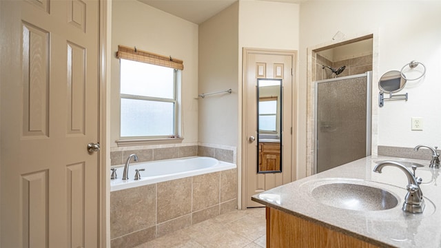 810 Prairie Wind Blvd, Stephenville, TX 76401 - full bath with a shower stall, a garden tub, tile patterned floors, and double vanity
