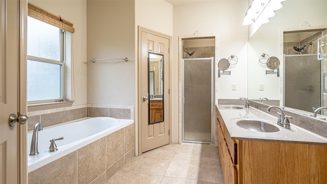 810 Prairie Wind Blvd, Stephenville, TX 76401 - bathroom with a shower stall, a garden tub, tile patterned floors, and double vanity