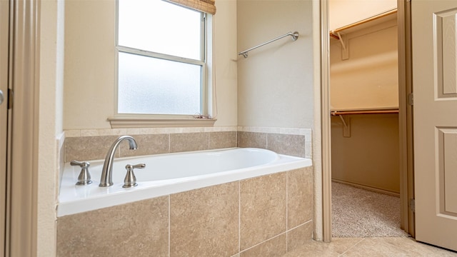 810 Prairie Wind Blvd, Stephenville, TX 76401 - full bathroom with a spacious closet, a garden tub, and tile patterned floors