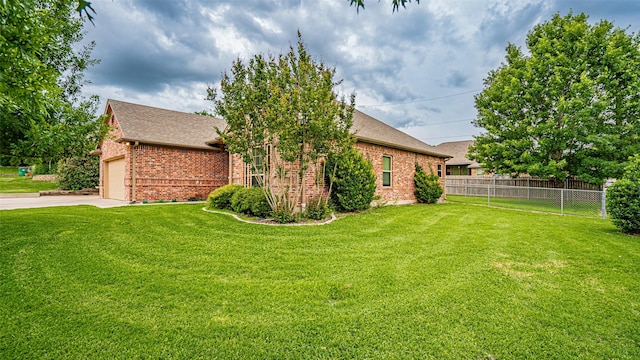 810 Prairie Wind Blvd, Stephenville, TX 76401 - view of side of home with brick siding, roof with shingles, and concrete driveway