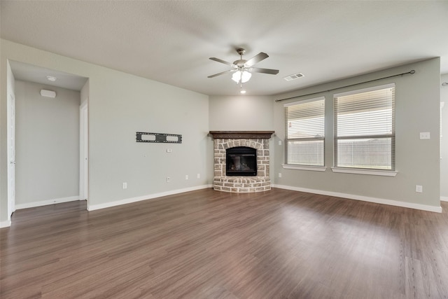 2122 Slow Stream Dr, Royse City, TX 75189 - unfurnished living room with ceiling fan, a fireplace, wood finished floors, and baseboards