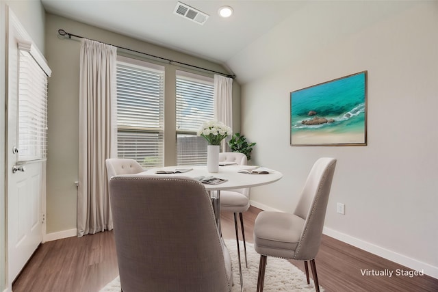 2122 Slow Stream Dr, Royse City, TX 75189 - dining room featuring wood finished floors, vaulted ceiling, and baseboards