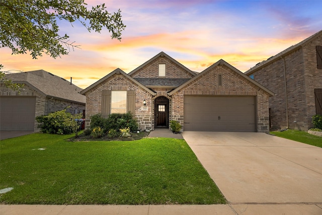 2122 Slow Stream Dr, Royse City, TX 75189 - french country home featuring brick siding, a front yard, an attached garage, and driveway