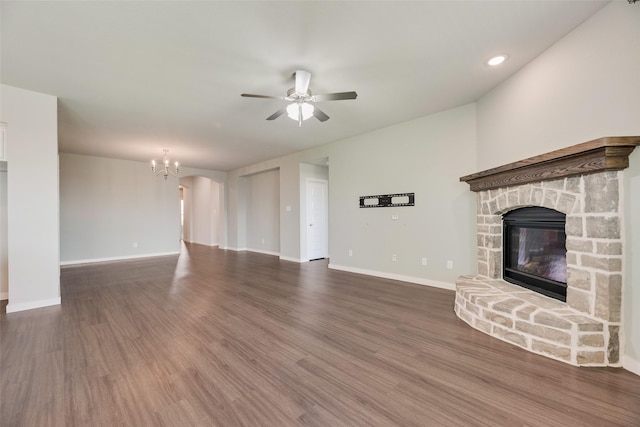 2122 Slow Stream Dr, Royse City, TX 75189 - unfurnished living room featuring a ceiling fan, a fireplace, wood finished floors, a chandelier, and baseboards