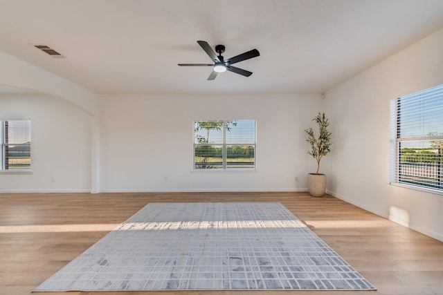 3732 Venera St, Fort Worth, TX 76106 - unfurnished room with wood finished floors, healthy amount of natural light, ceiling fan, and baseboards