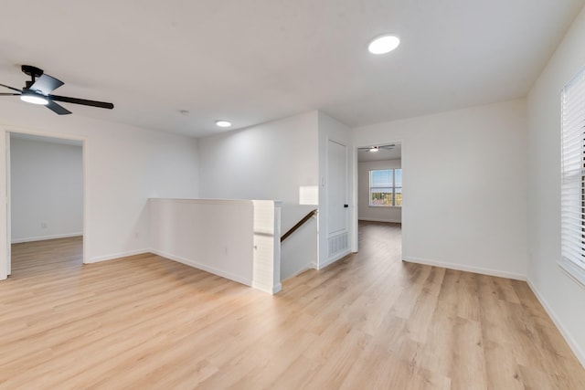 3732 Venera St, Fort Worth, TX 76106 - empty room featuring light wood-style floors, baseboards, and ceiling fan