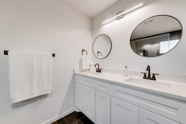 3732 Venera St, Fort Worth, TX 76106 - bathroom with double vanity, baseboards, and tile patterned floors