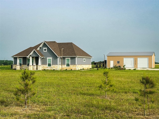 397 Hcr 2341, Abbott, TX 76621 - craftsman-style home with stone siding, an outdoor structure, a detached garage, and a front yard