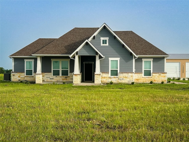 397 Hcr 2341, Abbott, TX 76621 - craftsman-style house with stone siding, central AC unit, a shingled roof, and a front lawn