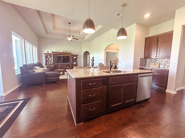 397 Hcr 2341, Abbott, TX 76621 - kitchen featuring stainless steel dishwasher, arched walkways, a sink, dark wood-style floors, and hanging light fixtures