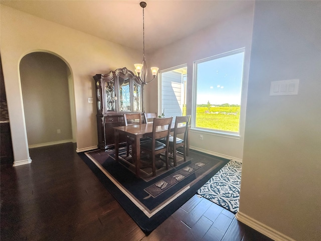 397 Hcr 2341, Abbott, TX 76621 - dining room with arched walkways, a chandelier, baseboards, and dark wood finished floors