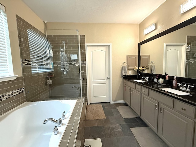 8608 Davis Dr, Frisco, TX 75036 - full bathroom with a stall shower, a garden tub, double vanity, and baseboards