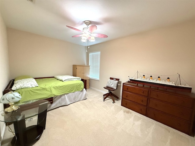 8608 Davis Dr, Frisco, TX 75036 - bedroom with light carpet, ceiling fan, and baseboards