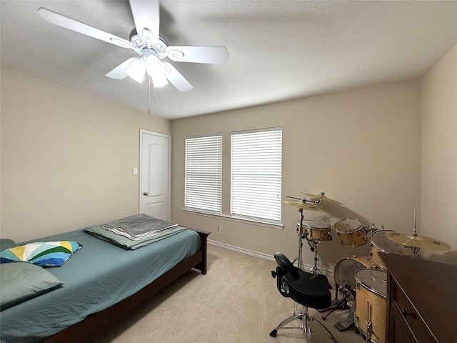 8608 Davis Dr, Frisco, TX 75036 - bedroom with light carpet, ceiling fan, and baseboards
