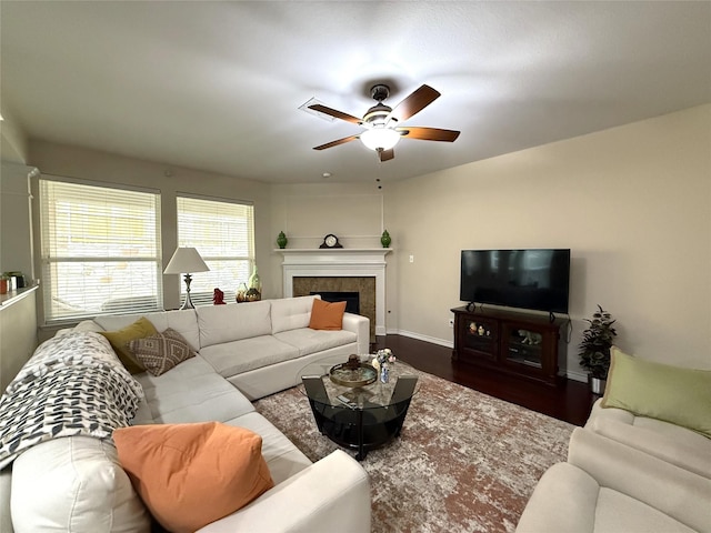8608 Davis Dr, Frisco, TX 75036 - living room featuring a ceiling fan, baseboards, wood finished floors, and a tile fireplace