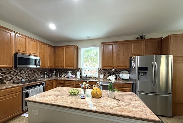 8608 Davis Dr, Frisco, TX 75036 - kitchen with stainless steel appliances, a sink, decorative backsplash, and a center island