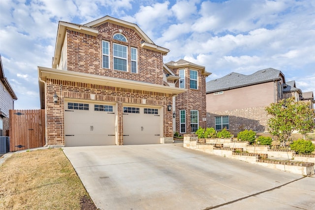 1324 Needle Cactus Dr, Fort Worth, TX 76177 - traditional home featuring brick siding, a garage, driveway, and central AC