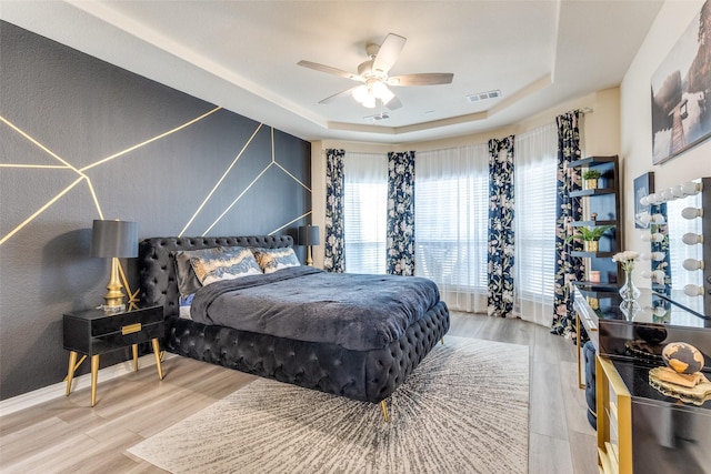 1324 Needle Cactus Dr, Fort Worth, TX 76177 - bedroom with a raised ceiling, wood finished floors, and a ceiling fan