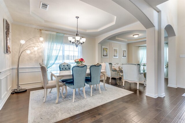 1324 Needle Cactus Dr, Fort Worth, TX 76177 - dining room with a tray ceiling, dark wood finished floors, a chandelier, crown molding, and wainscoting