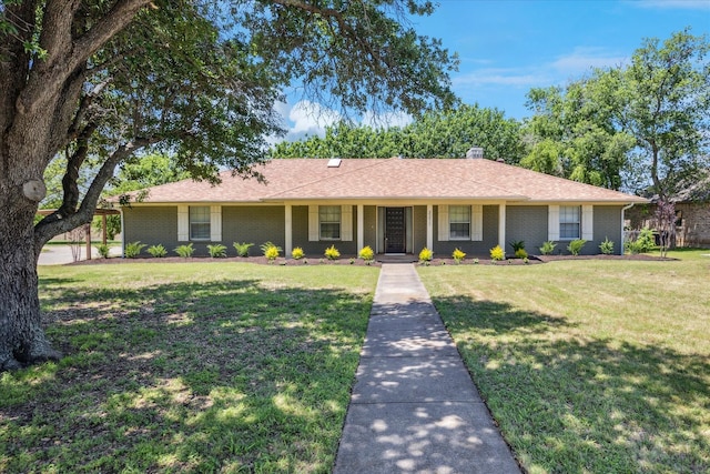 3211 Darby Ln, Denton, TX 76207 - ranch-style house with a front lawn and brick siding