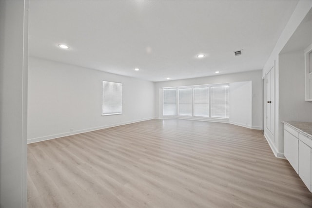 3211 Darby Ln, Denton, TX 76207 - unfurnished living room featuring light wood-type flooring, recessed lighting, and baseboards