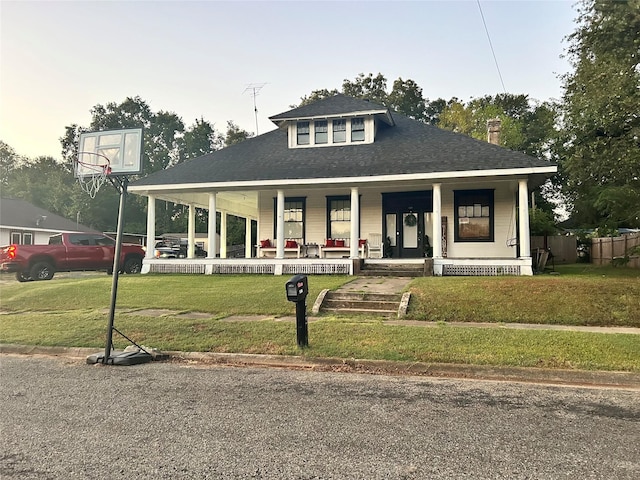 504 E 4th St, Mount Pleasant, TX 75455 - view of front of home featuring covered porch, a front lawn, and roof with shingles