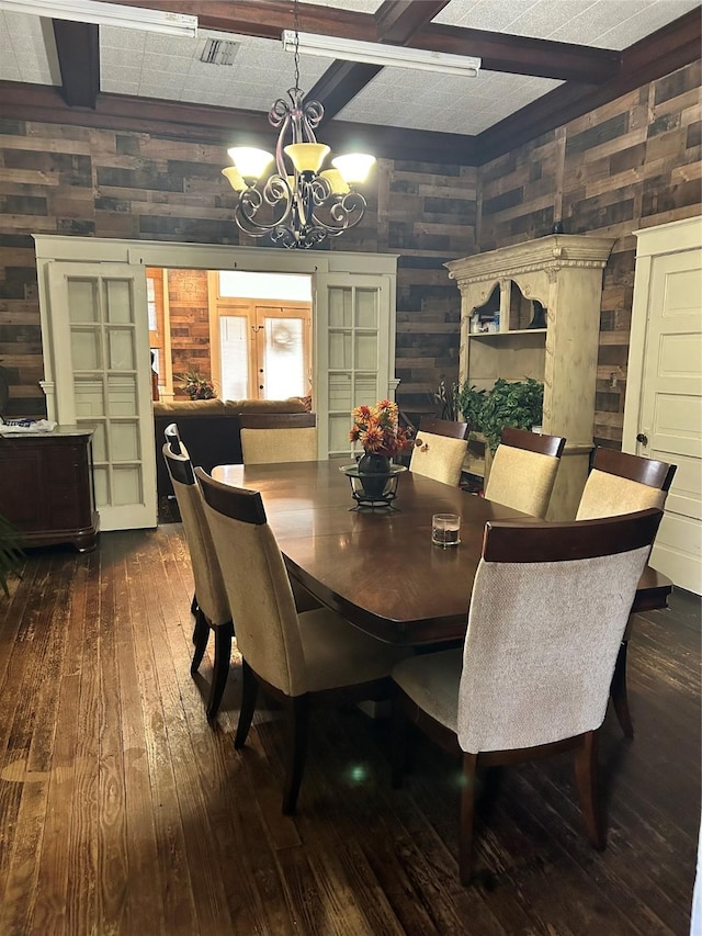 504 E 4th St, Mount Pleasant, TX 75455 - dining space featuring dark wood finished floors, a chandelier, and beamed ceiling