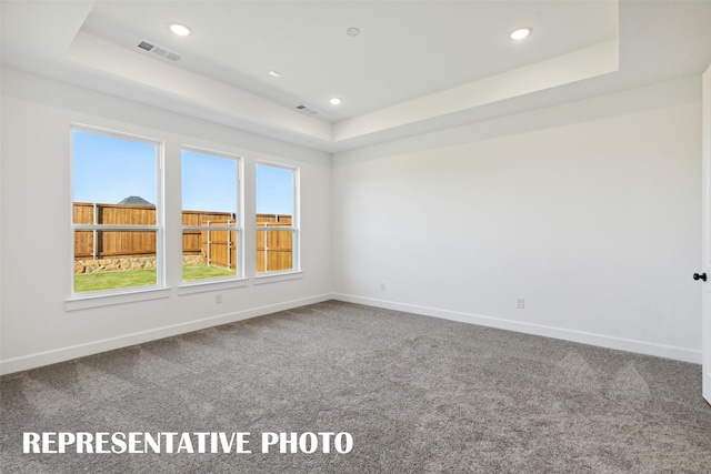 130 Scottish Way, Mansfield, TX 76063 - carpeted empty room featuring a tray ceiling, baseboards, and recessed lighting