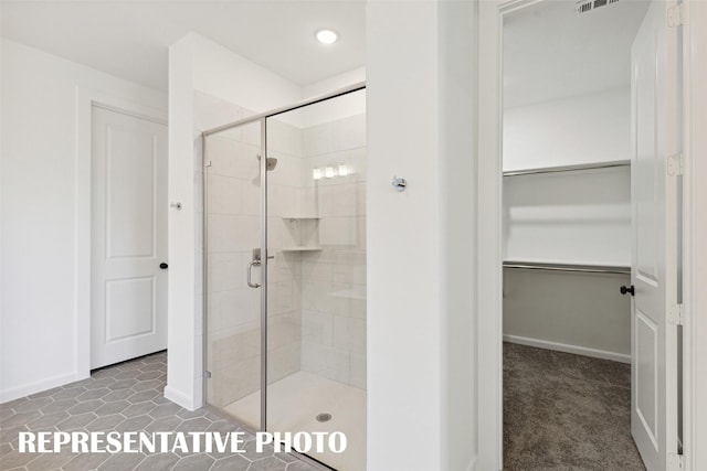 130 Scottish Way, Mansfield, TX 76063 - full bathroom featuring a shower stall, a walk in closet, baseboards, and recessed lighting