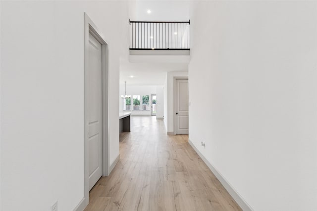 130 Scottish Way, Mansfield, TX 76063 - corridor with light wood-type flooring, baseboards, and a towering ceiling