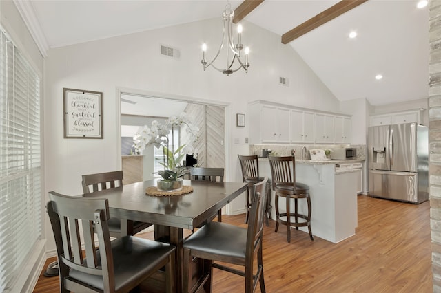 7624 Kevin Dr, Dallas, TX 75248 - dining room featuring a chandelier, light wood-type flooring, beamed ceiling, and high vaulted ceiling