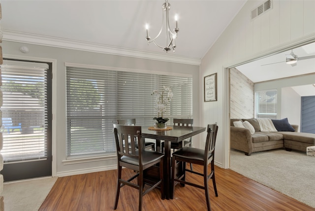 7624 Kevin Dr, Dallas, TX 75248 - dining area with lofted ceiling, ornamental molding, a chandelier, wood finished floors, and baseboards