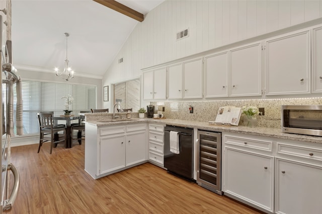 7624 Kevin Dr, Dallas, TX 75248 - kitchen with dishwasher, wine cooler, a chandelier, a peninsula, and white cabinets