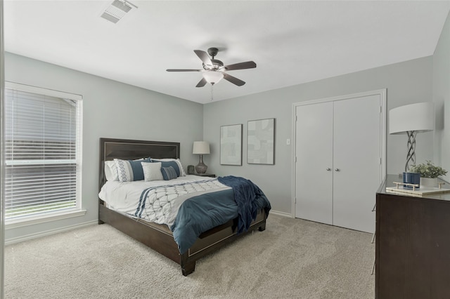 7624 Kevin Dr, Dallas, TX 75248 - bedroom with light colored carpet, baseboards, a ceiling fan, and a closet