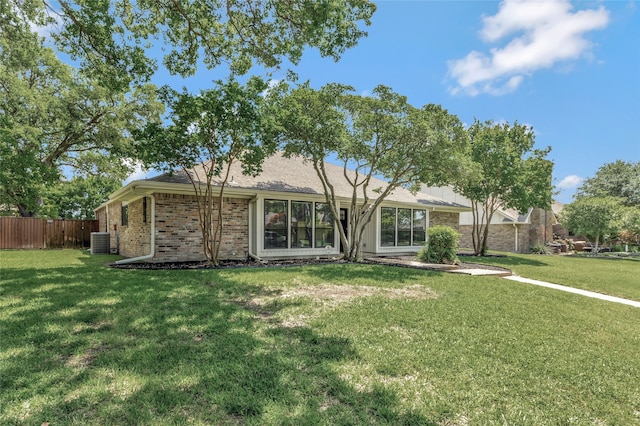 7624 Kevin Dr, Dallas, TX 75248 - rear view of house with brick siding and central AC