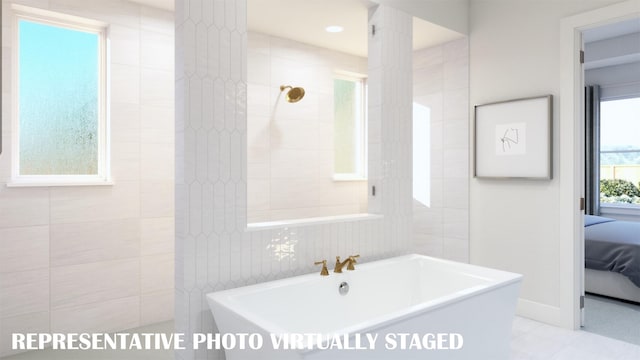 2112 Wakefield Ln, Allen, TX 75013 - ensuite bathroom featuring a soaking tub and tile walls