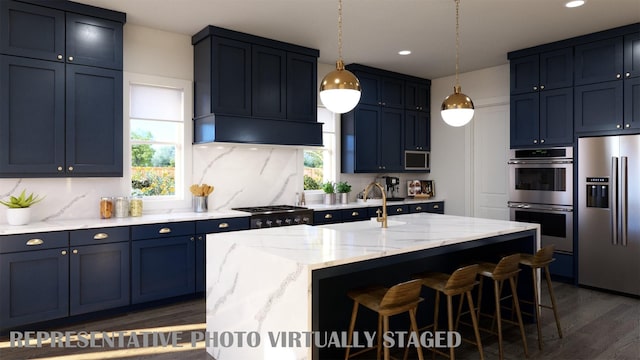 2112 Wakefield Ln, Allen, TX 75013 - kitchen featuring stainless steel appliances, custom range hood, dark wood finished floors, a kitchen breakfast bar, and light stone counters