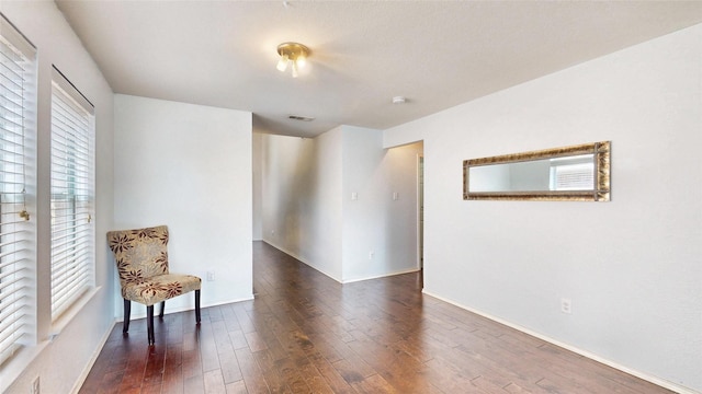 2225 Marion Dr, Mckinney, TX 75072 - sitting room with dark wood finished floors and baseboards