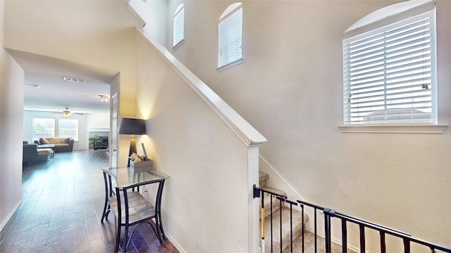 2225 Marion Dr, Mckinney, TX 75072 - stairs with a high ceiling, wood finished floors, ceiling fan, and baseboards