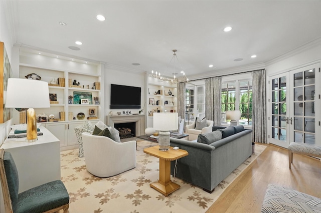 3219 Saint Johns Dr, Highland Park, TX 75205 - living area with crown molding, light wood-style floors, recessed lighting, built in features, and a fireplace