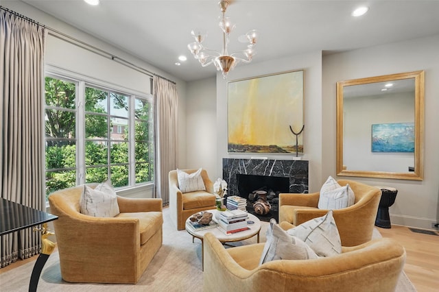 3219 Saint Johns Dr, Highland Park, TX 75205 - living area featuring recessed lighting, a high end fireplace, a chandelier, wood finished floors, and baseboards