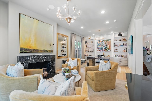 3219 Saint Johns Dr, Highland Park, TX 75205 - living area with recessed lighting, light wood-type flooring, a chandelier, and a premium fireplace