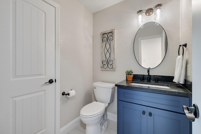 941 Mccampbell Rd, Mansfield, TX 76063 - half bathroom featuring toilet, vanity, baseboards, and a textured wall