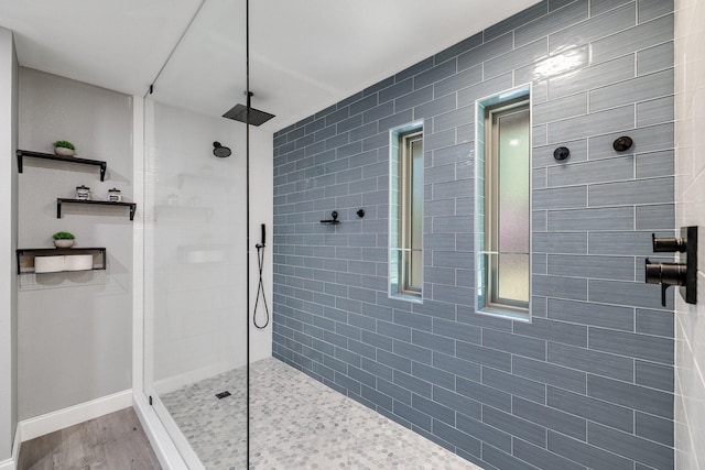 941 Mccampbell Rd, Mansfield, TX 76063 - bathroom with a walk in shower, wood finished floors, and baseboards