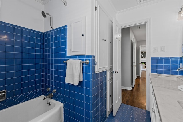 3824 Arundel Ave, Fort Worth, TX 76109 - full bath with vanity, tile walls, ornamental molding, washtub / shower combination, and tile patterned flooring